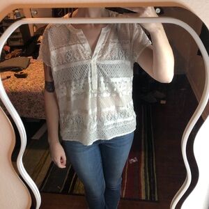 White lace blouse with a touch of whimsy